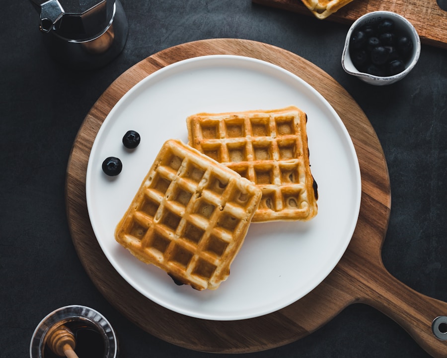 Golden deep-pocketed Belgian waffles with melting butter and pure maple syrup
