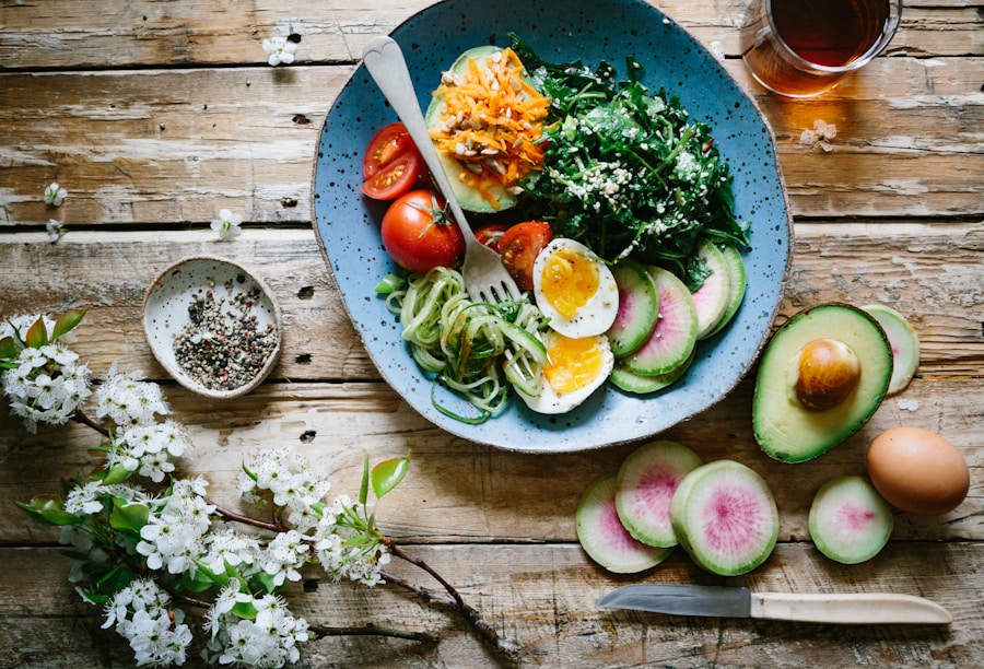 Bright green matcha smoothie bowl arranged with sliced kiwi, coconut, chia seeds, and granola