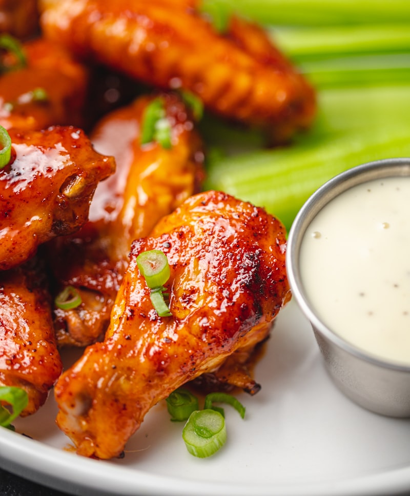 Crispy golden honey garlic chicken wings glistening with sticky sauce and toasted sesame seeds