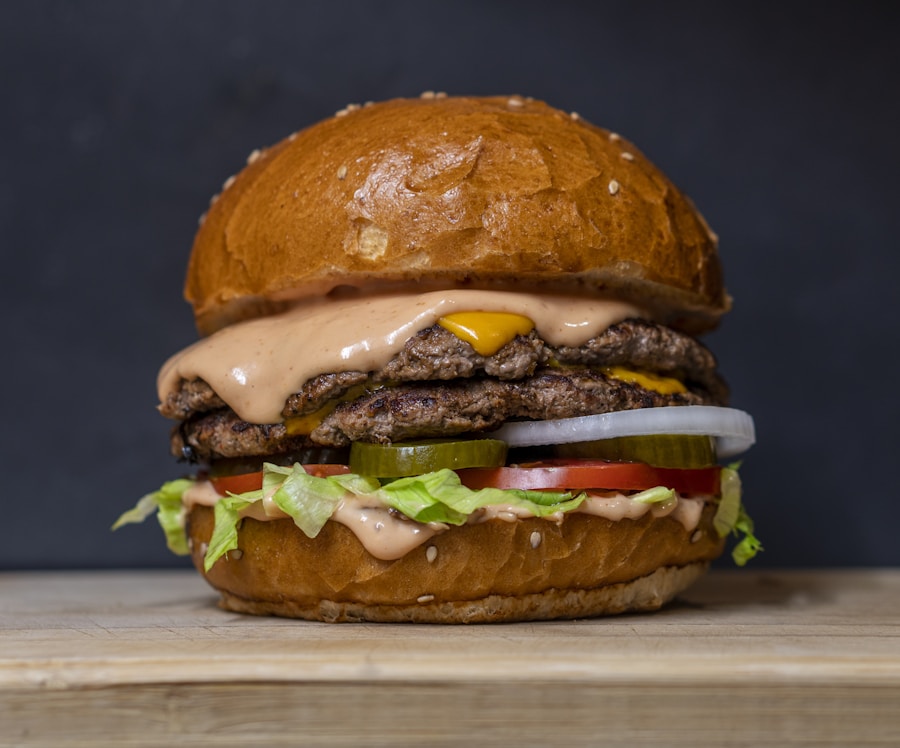 Double smashed cheeseburger with melted cheese dripping down toasted brioche bun